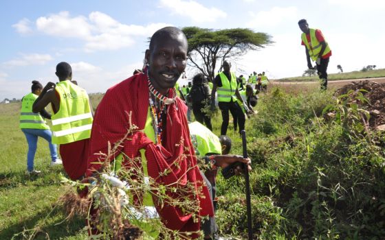 Amos Kwaite, a member of the Maasai community, joins Kenyans including members of the Laudato Si Movement in a cleanup of Nairobi National Park June 4. 2022, as part of the observance of World Environment Day. (CNS/Fredrick Nzwili)