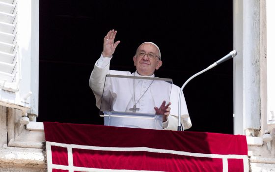 Pope Francis greets the crowd as he leads the Angelus from the window of his studio overlooking St. Peter's Square at the Vatican June 26. (CNS/Vatican Media)