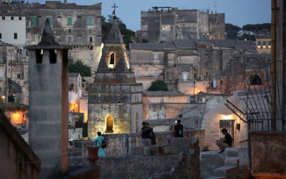 People enjoy the evening in Matera, Italy, June 29, 2021. Pope Francis will visit the southern Italian city Sept. 25 to celebrate the closing Mass of the Italian National Eucharistic Congress. (CNS/Reuters/Yara Nardi)