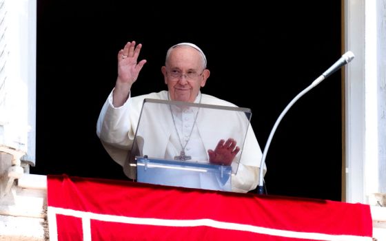 Pope Francis greets the crowd as he leads the Angelus from the window of his studio overlooking St. Peter's Square at the Vatican July 31, 2022. (CNS photo/Vatican Media via Reuters)