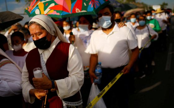 A nun joins people with missing relatives and victims of violence during a procession in Ciudad Juarez, Mexico July 28, 2022, in memory of their loved ones as part of the Praying Days for Peace called by the Catholic Church 