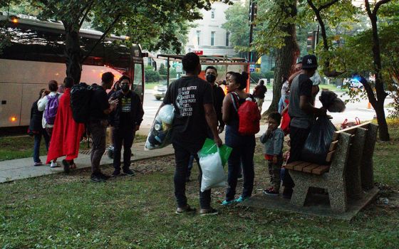 A group of mainly Venezuelan migrants sent by bus to Washington from detention in Texas are dropped off Sept. 17 outside the Naval Observatory, the official residence of Vice President Kamala Harris. (CNS/Reuters/Marat Sadana)