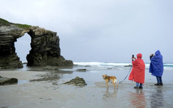 Tourists visit Cathedral Beach at low tide in Ribadeo, Spain, Sept. 25, 2022. (CNS photo/Nacho Doce, Reuters)