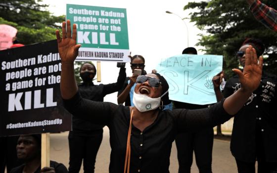 A woman reacts during a protest in Abuja, Nigeria, Aug. 15, 2020. The demonstration was against the continued killings in southern Kaduna and insecurities in Nigeria. Deadly violence hit Christians in Africa Jan. 15, 2023, with a Catholic priest in northern Nigeria burned to death and as many as 17 Christians killed in a blast in eastern Democratic Republic of Congo. (OSV News photo/Afolabi Sotunde, Reuters)