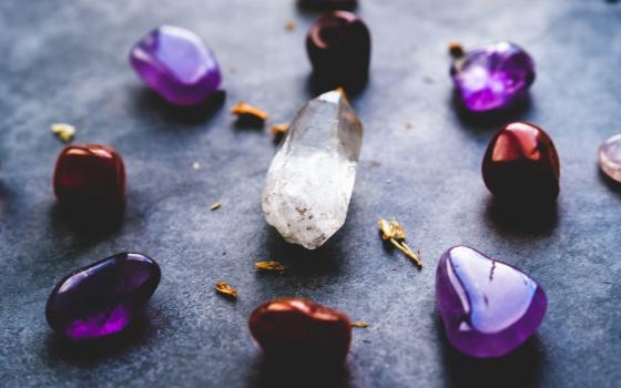 White and purple crystals sit in a circle