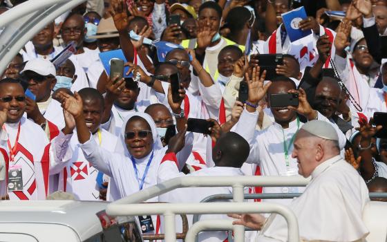 Pope Francis greets the crowd before celebrating Mass at Ndolo airport in Kinshasa, Congo, Feb. 1, 2023. (CNS photo/Paul Haring)