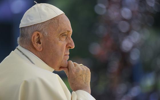 Pope Francis listens to a young person during a meeting with university students at the Catholic University of Portugal Aug. 3 in Lisbon. On Aug. 2 Francis capped off his first day in Portugal by meeting with 13 clergy abuse survivors. (CNS/Vatican Media)