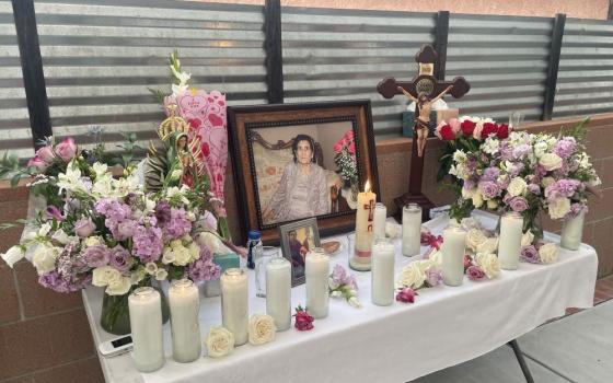 Candles, flowers and photo on table