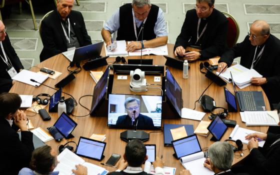 Members of the assembly of the Synod of Bishops begin work on the communion as the second theme of the synod in the Vatican's Paul VI Audience Hall Oct. 9, 2023. (CNS photo/Lola Gomez)