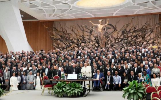 Pope Francis poses for a picture with participants of the Synod of Bishops' 16th General Assembly in the Paul VI Hall at the Vatican, Oct. 23. (AP/Gregorio Borgia)