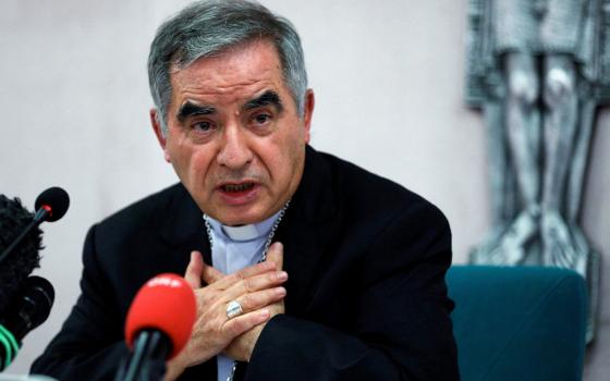 Cardinal Angelo Becciu speaks with journalists during a news conference in Rome in this Sept. 25, 2020, file photo. Vatican prosecutors continued their cross-examination May 18-19 of Cardinal Becciu in a Vatican trial focused on financial malfeasance and mismanagement. (CNS photo/Guglielmo Mangiapane, Reuters)