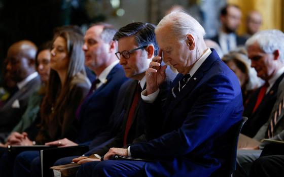 U.S. President Joe Biden pauses as he sits alongside House Speaker Mike Johnson, R-Louisiana, during the annual National Prayer Breakfast at the U.S. Capitol in Washington Feb. 1, 2024. (OSV News/Reuters/Evelyn Hockstein)