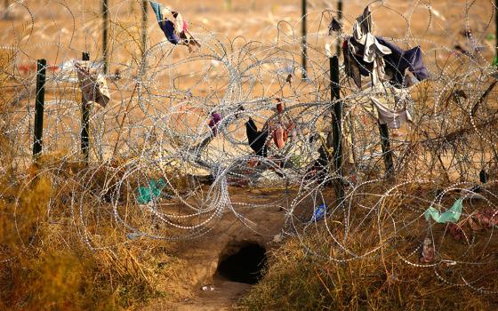 A hole is seen from Ciudad Juarez, Mexico, Feb. 1, 2024, near a razor wire fence the state of Texas is using to prevent migrants from crossing into the U.S. at the border. U.S. senators Feb. 4 unveiled a deal on border enforcement paired with security assistance for Ukraine, Israel and Indo-Pacific countries. (OSV News/Reuters/Jose Luis Gonzalez)