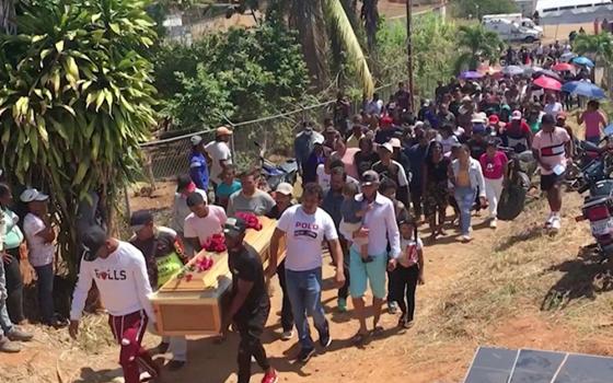 People carry a casket of a miner during his funeral in La Paragua, Bolivar, Venezuela, Feb. 22, 2024, who died when an illegal gold mine collapsed. Miners are still being evacuated from Venezuelan gold mine that collapsed Feb. 20, as church leaders call for more support for Indigenous people. (OSV News screenshot/Reuters TV)