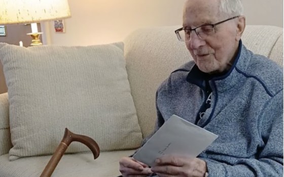 Bishop Thomas Gumbleton holds a letter from Pope Francis on Jan. 26.