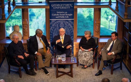 Ralph McCloud (second from left), then- director of the U.S. bishops' Catholic Campaign for Human Development, participates in a panel discussion on the debt ceiling May 31, 2023, at Georgetown. 