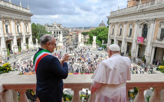 Pope and Mayor on balcony facing out towards St. Peter's Square. 