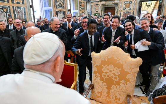 Pope Francis engages in a light-hearted moment with comedians Stephen Colbert, Chris Rock, Jimmy Fallon and other comedians after an audience at the Vatican June 14, 2024. (CNS/Vatican Media)