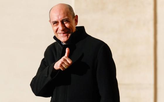 Cardinal Víctor Manuel Fernández, prefect of the Dicastery for the Doctrine of the Faith, gives a thumb up to journalists in the San Damaso Courtyard of the Apostolic Palace at the Vatican Feb. 12, 2024. (CNS/Lola Gomez)
