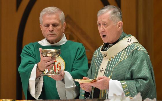 Chicago Cardinal Blase Cupich, right, celebrates Mass at Holy Name Cathedral in Chicago June 30, for the perpetual pilgrims on the Marian Route of the National Eucharistic Pilgrimage and others joining the pilgrimage as it made its way through Chicago. Cupich spoke at the National Eucharistic Congress July 18 in Indianapolis. (OSV News/Simone Orendain)