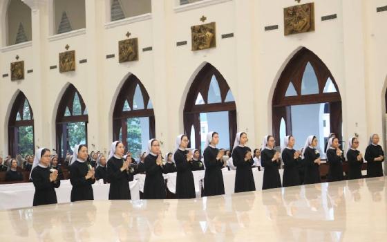 Twelve Sisters of Mary, Queen of the World, in Vietnam make their first profession in 2024, marking a significant commitment to living out the congregation's charism of evangelical spiritual childhood, a way of life rooted in the Gospel message, "Unless you turn and become like little children, you will not enter the kingdom of heaven." (Courtesy of Maria Yen Do)