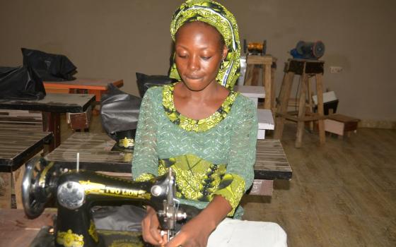 Janada Markus works on a clothing project at the skill acquisition department of the Salama Centre in Maiduguri.