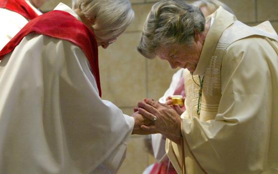 Patricia Fresen, right, greets Elsie Hainz McGrath during a ceremony at which McGrath and another woman where ordained by Fresen at the Central Reform Congregation Synagogue in St. Louis in this Nov. 11, 2007, file photo. (CNS photo/Karen Elshout)