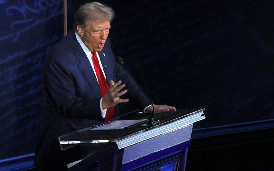 Former U.S. President Donald Trump, the Republican presidential candidate, gestures as he takes part in the first presidential debate with Vice President Kamala Harris, the Democratic presidential candidate, at the National Constitution Center Sept. 10 in Philadelphia. (OSV News/Reuters/Brian Snyder)