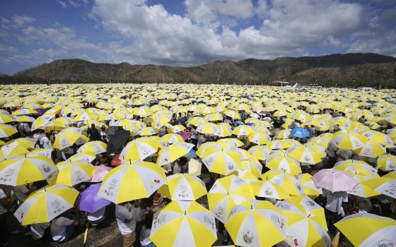 East Timorese crowd Tacitolu park for Pope Francis' Mass in Dili, East Timor, Tuesday, Sept. 10, 2024. (AP Photo/Firdia Lisnawati)