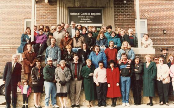 The staff of the National Catholic Reporter Publishing Company is pictured in this 1994 Christmas photo, taken outside the company's headquarters in Kansas City, Missouri. (NCR file photo)