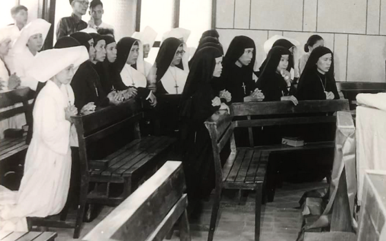 St. Paul de Chartres sisters are pictured praying in their convent in June 1954, in what is today Vietnam's Thanh Hoa Diocese, before they migrated to the south. (Courtesy of Sisters of St. Paul de Chartes)