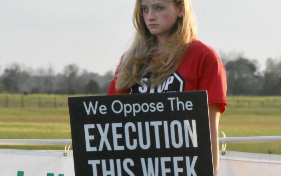 A student from Lourdes Academy Catholic School in Daytona Beach, Fla., protests the death penalty at the Florida State Prison Feb. 23, 2023. Some 200 death row prisoners have been exonerated. (OSV News/Florida Catholic/Glenda Meekins)