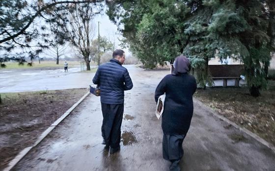 Earlier this year, Fr. Aleksandr Bohomoz and Basilian Sr. Lucia Murashko prepare to enter a triage center in Velykomykhajlivka in southeastern Ukraine. (NCR photo/Chris Herlinger)