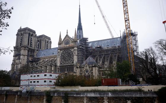 Cranes are seen around the Notre Dame Cathedral in Paris Nov. 7, which was ravaged by a fire in 2019, as restoration work continued before its reopening. The iconic cathedral is scheduled to reopen Dec. 8, to be followed by six months of celebrations, Masses, pilgrimages, prayers and exhibitions. (OSV News/Reuters/Sarah Meyssonnier)