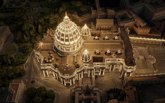 Aerial depiction of St. Peter's outlined with lights.