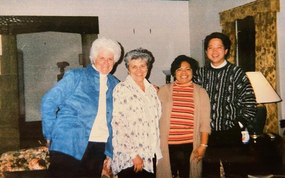 Social Service Srs. Michele Walsh, Carol Pack, Nodelyn Abayan and Fr. Joel Henson at the formation house in February 2003. (Courtesy of Nodelyn Abayan)