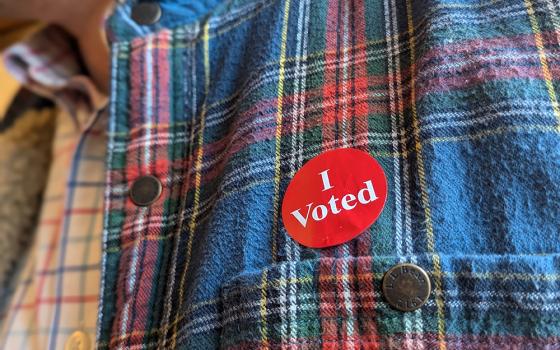 A Minnesota voter wears his "I Voted" sticker after casting an early ballot in St. Paul Nov. 1, 2024. National Catholic Reporter named the Catholic voter its Newsmaker of the Year. (OSV News/Maria Wiering)