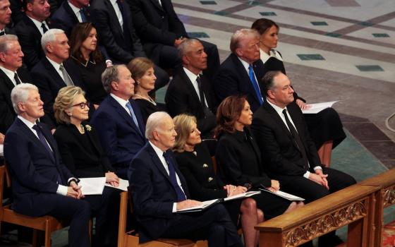 Four rows of seating pictured, containing living presidents and vice presidents.