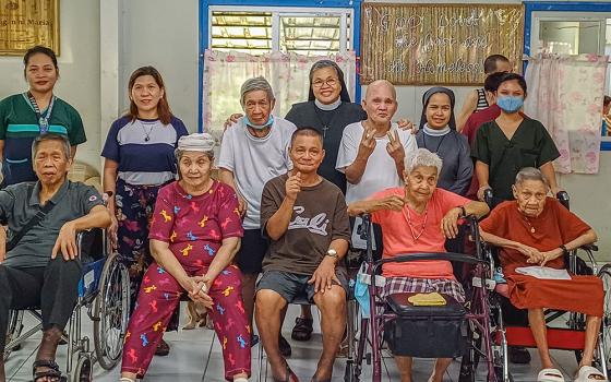 Residents of Kanlungan ni Maria Home for the Aged in Antipolo City, Philippines, pose for a photo together with the nuns and staff. (GSR photo/Oliver Samson)