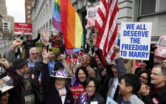 Advocates of same-sex marriage cheer during a rally outside the 9th Circuit Court of Appeals in San Francisco Feb. 7 moments before hearing the court's decision on Proposition 8. By a 2-1 vote, a three-judge panel struck down the California ban on same-sex marriage, saying that it violates the 14th Amendment to the U.S. Constitution (CNS/Reuters/Beck Diefenbach)