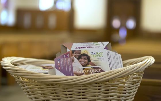 Envelopes for Catholic Relief Services' Rice Bowl program are displayed in this illustration file photo. CRS is the overseas relief and development agency of the Catholic Church in the U.S. (OSV News/Octavio Duran)