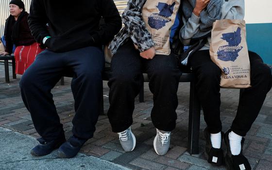 Migrants are seen outside a repatriation center in Guatemala City, Guatemala, after arriving on a deportation flight from the U.S. that landed at La Aurora Air Base on Jan. 27. (OSV News/Reuters/Josue Decavele)