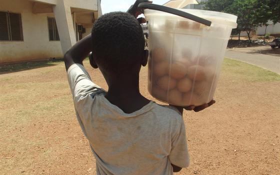 A boy sells eggs on the streets of Bangui, Central African Republic, in April 2021. (CNS/Reuters/Ines Kpakole)