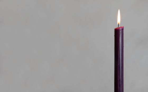 Lit purple candle