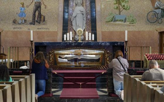 People pray during Eucharistic adoration in the chapel of St. Frances Cabrini Shrine in Upper Manhattan in New York City on March 3, 2024. Mother Cabrini, canonized in 1946, is the patron saint of immigrants. Her remains are encased in a glass casket embedded in the chapel's altar. (OSV/Gregory A. Shemitz)