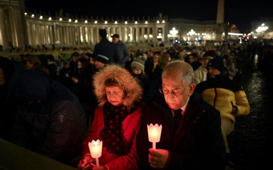 Worshippers attend a prayer service in St. Peter's Square March 2, while Pope Francis continues receiving treatment for double pneumonia after being admitted to Rome's Gemelli Hospital Feb. 14. (OSV News/Reuters/Dylan Martinez)