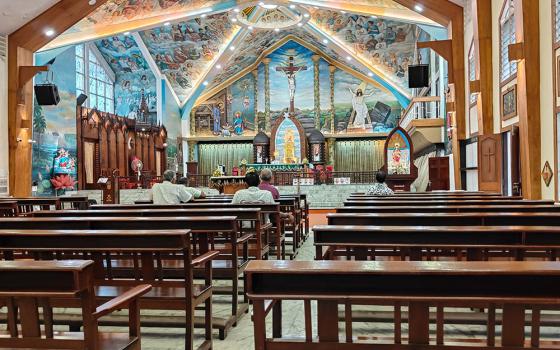 People pray at the St. Mary's Basilica Cathedral, the main church of the Ernakulam-Angamaly Archdiocese in the southwestern Indian state of Kerala. (Thomas Scaria)