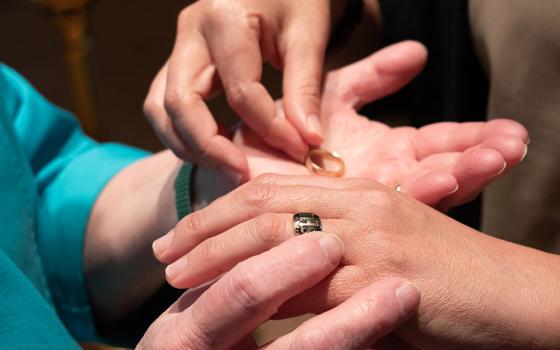 After signing her handwritten monastic vows, she removes the ring of her former community, leaves it with the document at the altar and after singing "Receive me, o Lord as you have promised that I may live, disappoint me not in my hope" three times, she receives the Benedictine ring, as a sign of her total incorporation into the Benedictine community of Mount St. Scholastica. (Courtesy of Helga Leija)