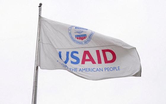 A flag flies outside the U.S. Agency for International Development building Feb. 3 in Washington, as the agency sits closed to employees after a memo was issued advising USAID personnel to work remotely. (OSV News/Reuters/Kent Nishimura)