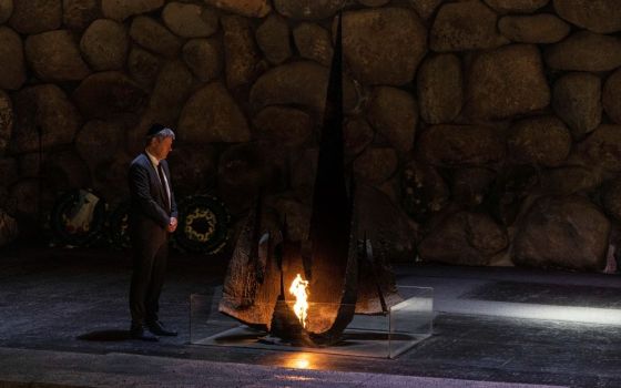 German Vice Chancellor and Economy and Climate Minister Robert Habeck rekindles the Eternal Flame in the Hall of Remembrance at the Yad Vashem World Holocaust Remembrance Center in Jerusalem June 7. (AP/Tsafrir Abayov)